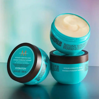 Turquoise-colored hydrating hair mask containers with cream product visible.