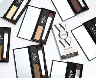 Color + Style Wow root cover up powder compacts in black and white packaging.