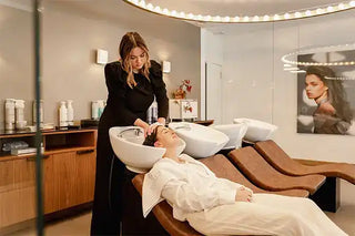 Hair washing station at a salon with reclining shampoo chairs.