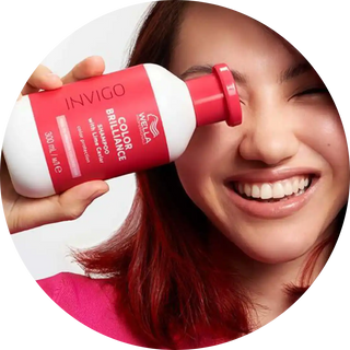 Red and white Invigo hair product bottle.