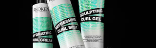 Redken hydrating curl cream tube with teal accents and white label design.
