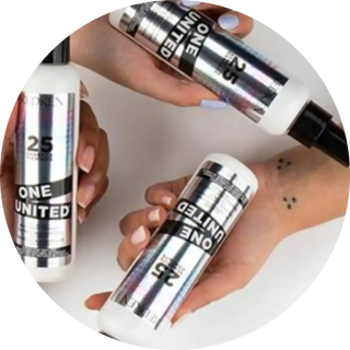 Silver metallic energy drink cans with ’One United’ branding.