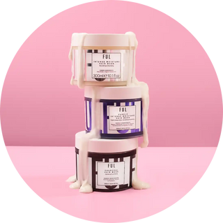 Three stacked FUL brand skincare jars in white and purple packaging.